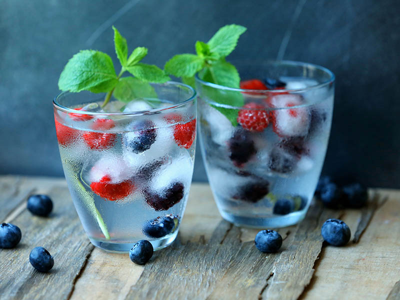 Image of Refreshing Summer Drink Berries in ice cubes